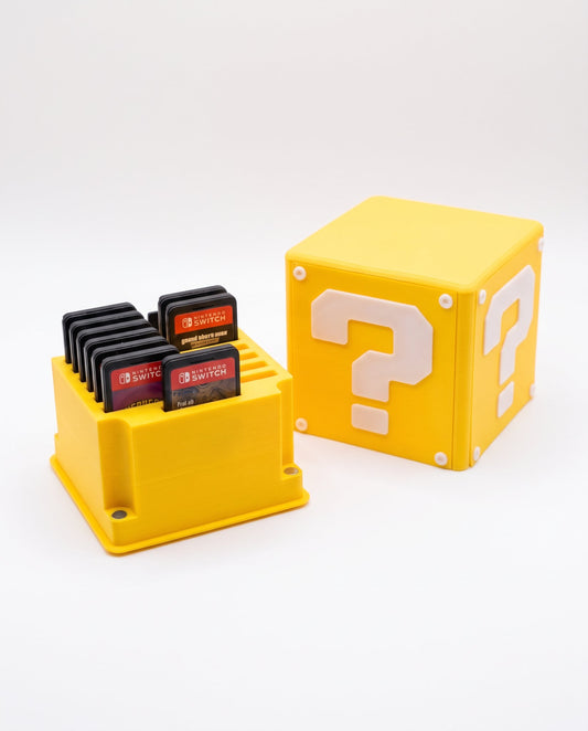 Cubo ? de Mario abierto con cartuchos de Switch adentro